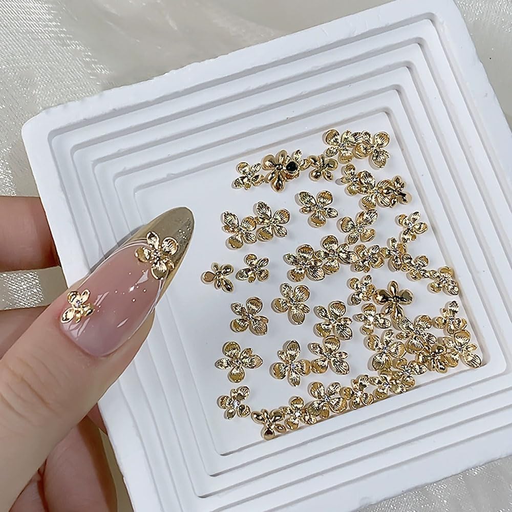 40PCS Gold Flower Nail Art Charms, 3D Metal Alloy Nail Charms Cute Mini Floral Blossom Designs Manicure Jewelry Charms Rhinestones for Women Nail Art DIY