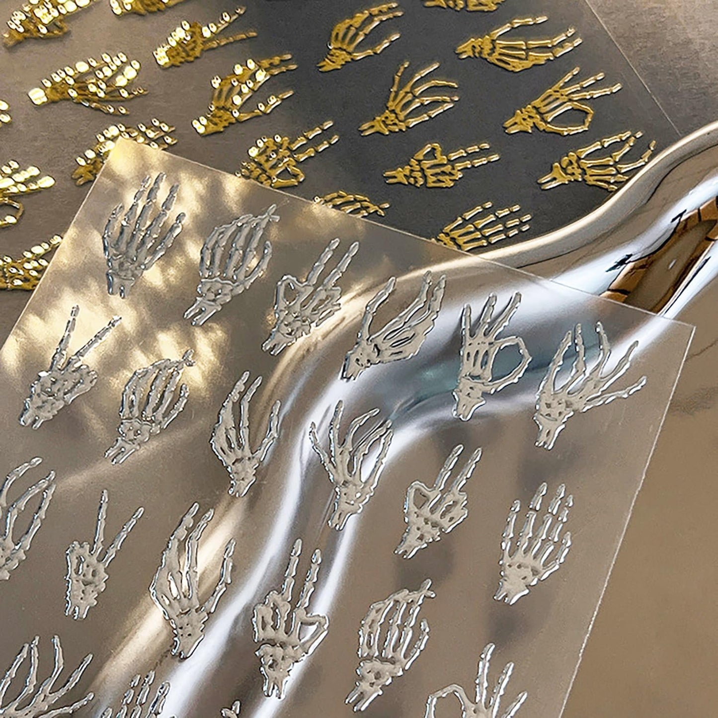 2 Sheets 5D Halloween Nail Stickers for Nail Art Self-Adhesive Embossed Hand Bones Nail Art Stickers Gold Silver Horror Hand Bone Nail Decals Halloween Nail Design Sticker for Women DIY Manicure